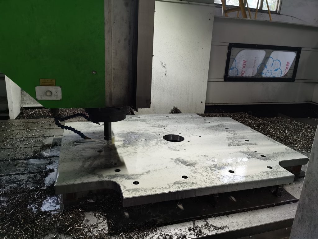 Machining of mold clamp magnetic platen, solid steel block construction.